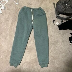 Size XS amazon teal joggers insulated with white fuzz